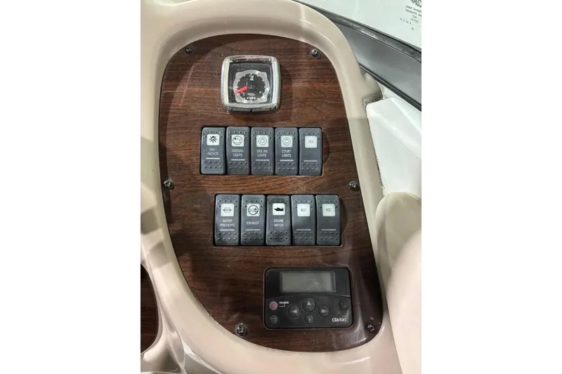 Slide: The Image of Control panel of a 2008 Chaparral 246 SSi boat with switches and gauges. - 11