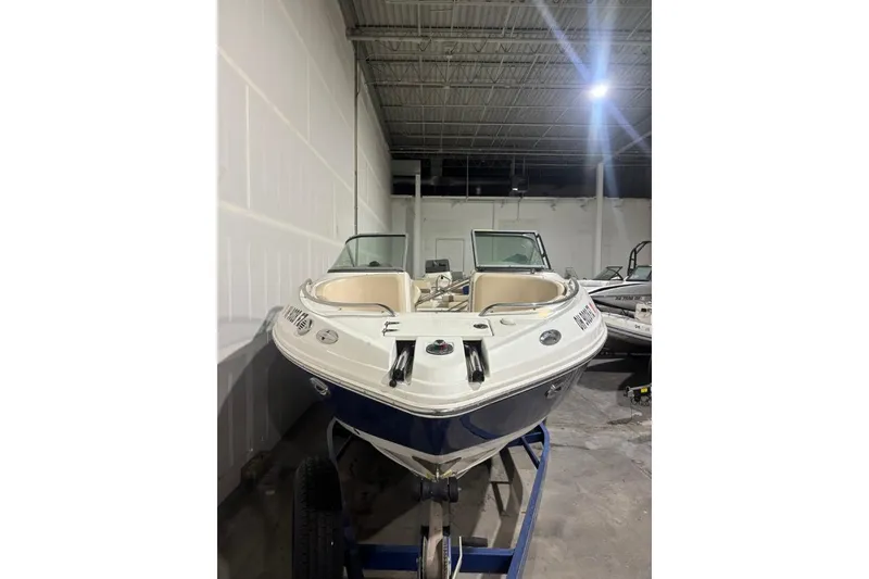 Slide: The Image of 2008 Chaparral 246 SSi boat in indoor storage, front view. - 2