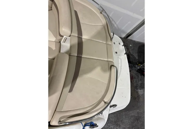 Slide: The Image of 2008 Chaparral 246 SSi boat with beige seating and stainless steel railings. - 25
