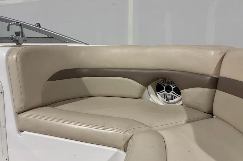 Slide: The Image of 2008 Chaparral 246 SSi boat interior with beige seating and built-in speaker. - 26
