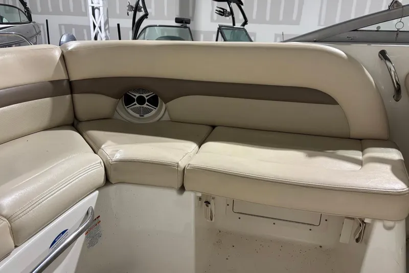 Slide: The Image of 2008 Chaparral 246 SSi boat interior with beige seating and speaker detail. - 27