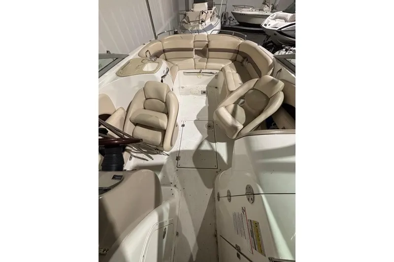 Slide: The Image of 2008 Chaparral 246 SSi boat interior with beige seating and steering wheel. - 29