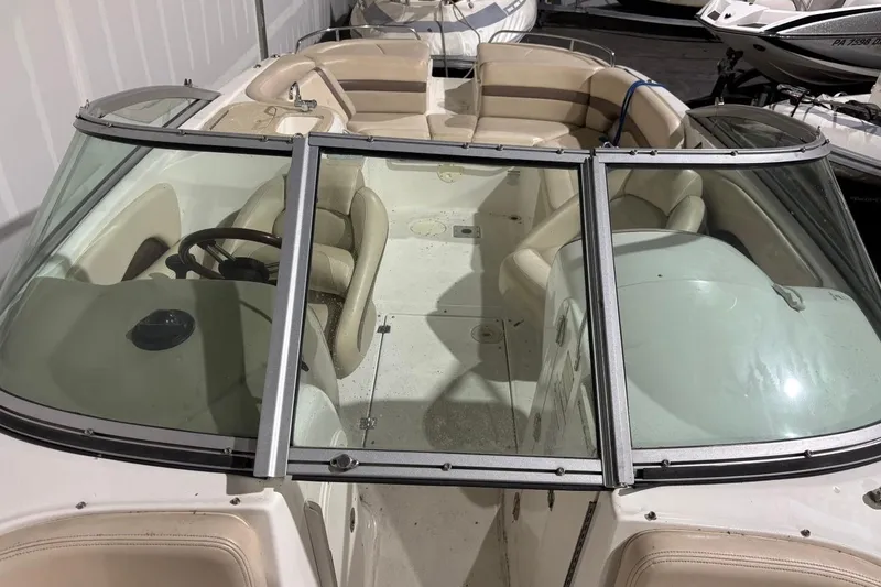 Slide: The Image of 2008 Chaparral 246 SSi boat interior with beige seating and steering wheel. - 30