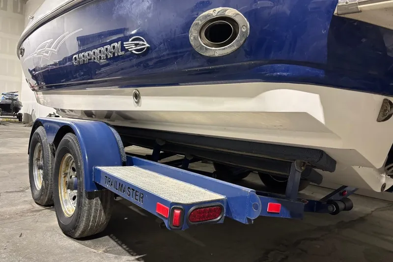Slide: The Image of 2008 Chaparral 246 SSi boat on a Trailmaster trailer in a garage. - 34
