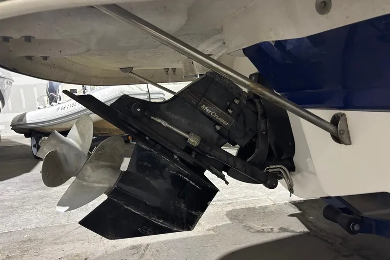 Slide: The Image of 2008 Chaparral 246 SSi boat with MerCruiser outdrive and propeller in a storage area. - 37