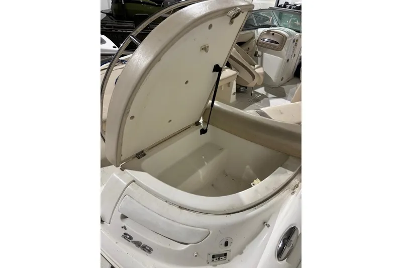 Slide: The Image of 2008 Chaparral 246 SSi boat interior with open storage compartment. - 39