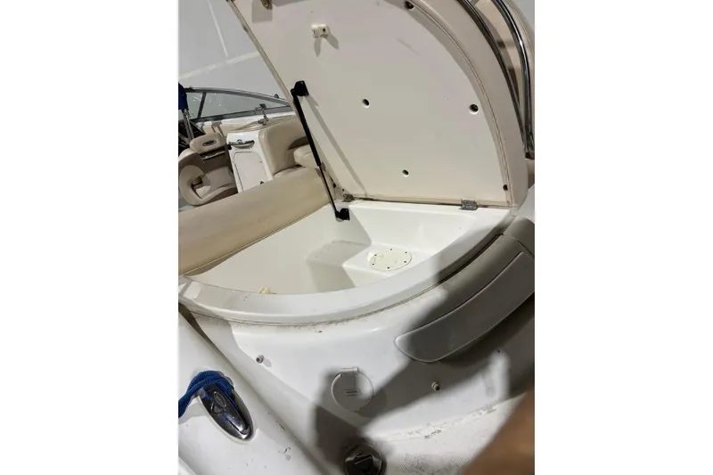 Slide: The Image of Open storage compartment on 2008 Chaparral 246 SSi boat, showcasing interior space. - 40