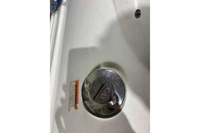 Slide: The Image of Gas cap on 2008 Chaparral 246 SSi boat with warning label visible. - 41