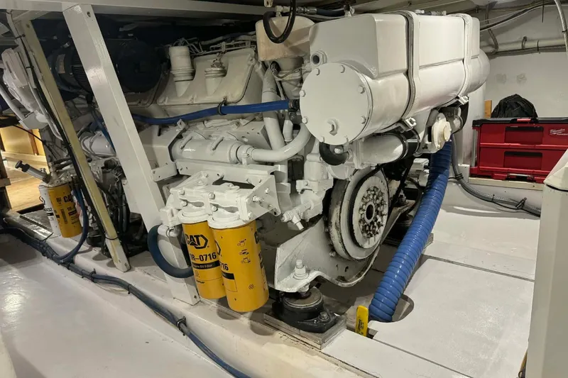 Slide: The Image of Engine room of a 1992 Blackwell Custom Carolina boat with visible CAT components. - 13