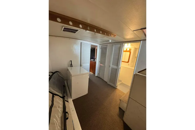 Slide: The Image of Interior of 1992 Blackwell Custom Carolina boat with white walls and carpeted floor. - 6