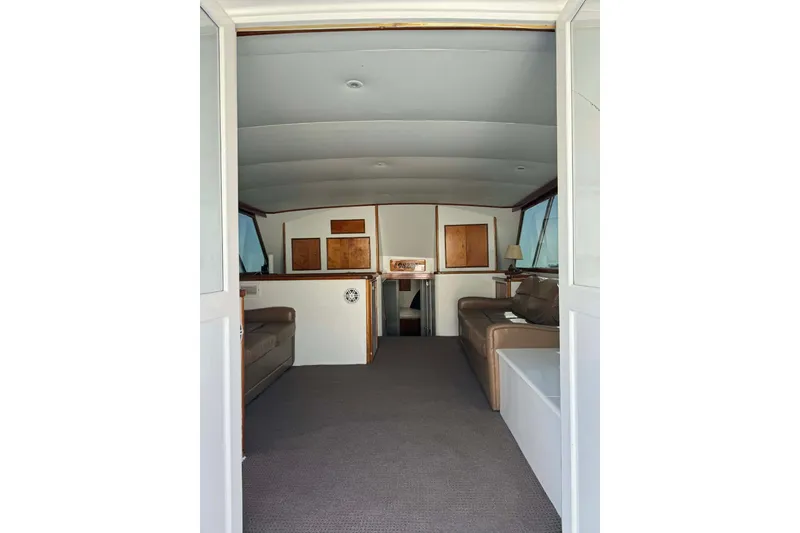 Slide: The Image of Interior of 1992 Blackwell Custom Carolina boat, featuring spacious seating and wooden accents. - 10