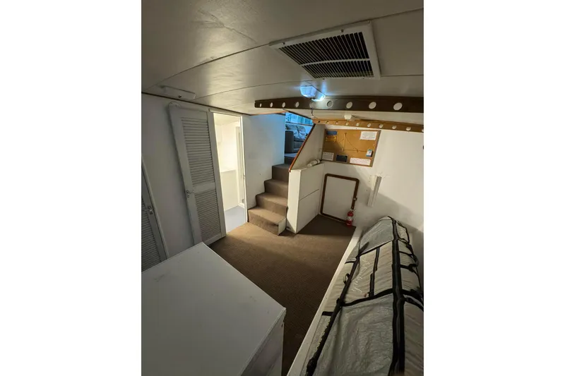 Slide: The Image of Interior of 1992 Blackwell Custom Carolina boat with stairs and storage area. - 11