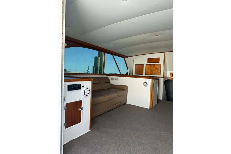 Slide: The Image of Interior of 1992 Blackwell Custom Carolina boat with seating and wooden accents. - 8