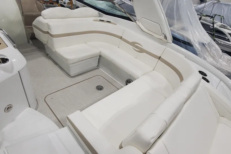 Slide: The Image of 2012 Formula 310 Sun Sport boat interior with white seating and elegant design. - 12