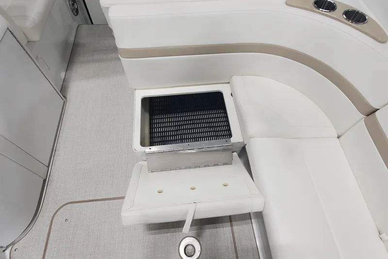 Slide: The Image of 2012 Formula 310 Sun Sport boat interior with white seating and built-in grill. - 14