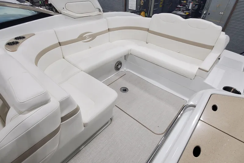 Slide: The Image of Luxurious seating area on a 2012 Formula 310 Sun Sport boat with beige accents. - 17