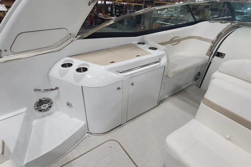 Slide: The Image of Interior of a 2012 Formula 310 Sun Sport boat, featuring seating and storage. - 18