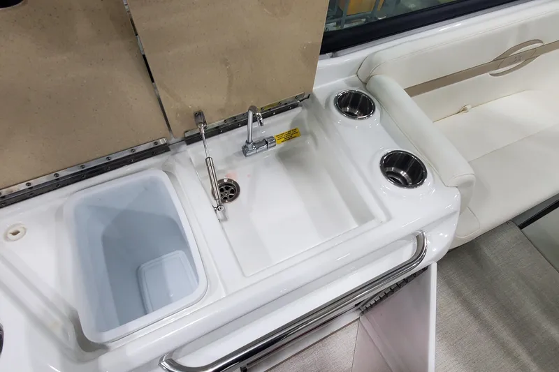 Slide: The Image of 2012 Formula 310 Sun Sport boat interior with sink and seating area. - 19