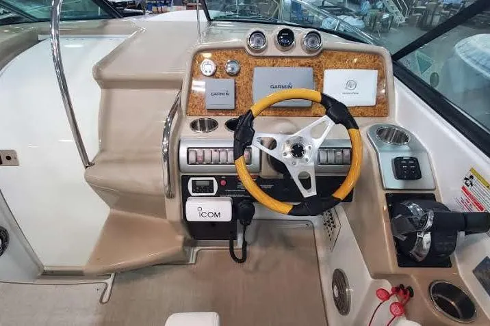 Slide: The Image of 2012 Formula 310 Sun Sport boat dashboard with Garmin navigation and Icom communication systems. - 22