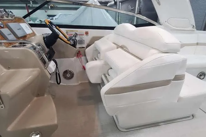 Slide: The Image of 2012 Formula 310 Sun Sport boat interior with white seating and modern dashboard. - 23