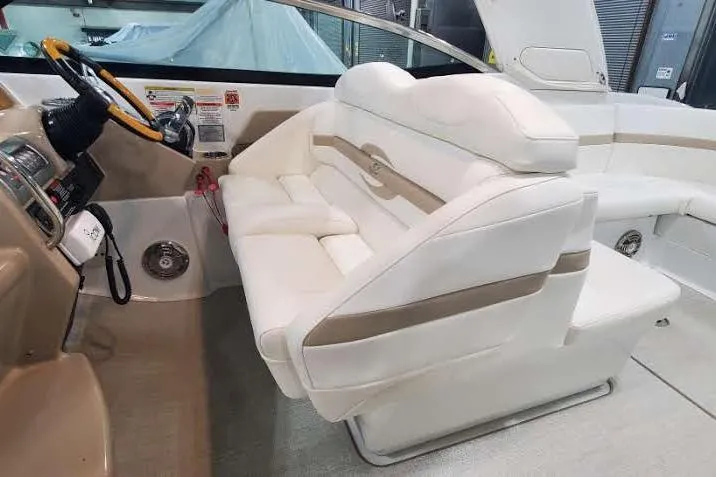 Slide: The Image of Luxurious interior of a 2012 Formula 310 Sun Sport boat with plush white seating. - 24