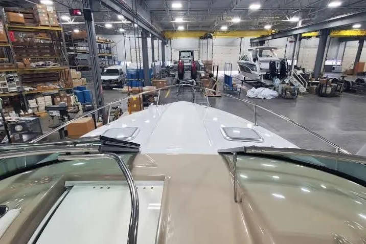 Slide: The Image of 2012 Formula 310 Sun Sport boat in a spacious indoor storage facility. - 27