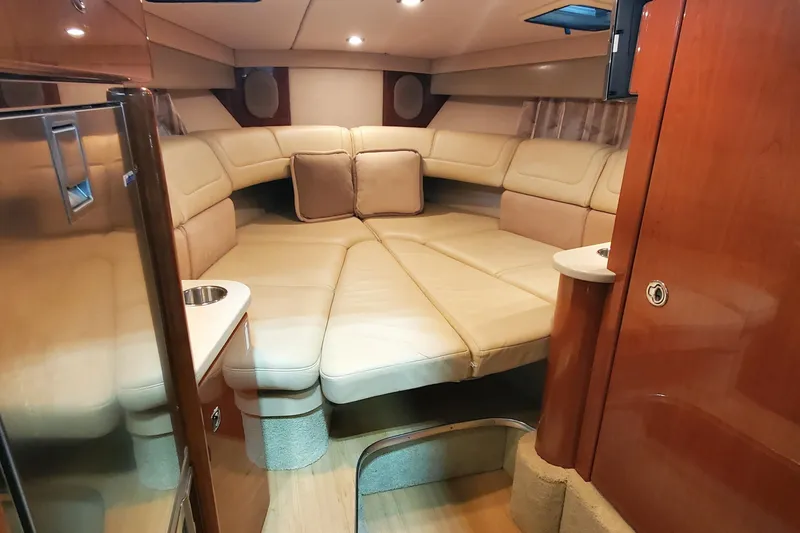 Slide: The Image of Luxurious interior of 2012 Formula 310 Sun Sport boat with plush seating and wood accents. - 31