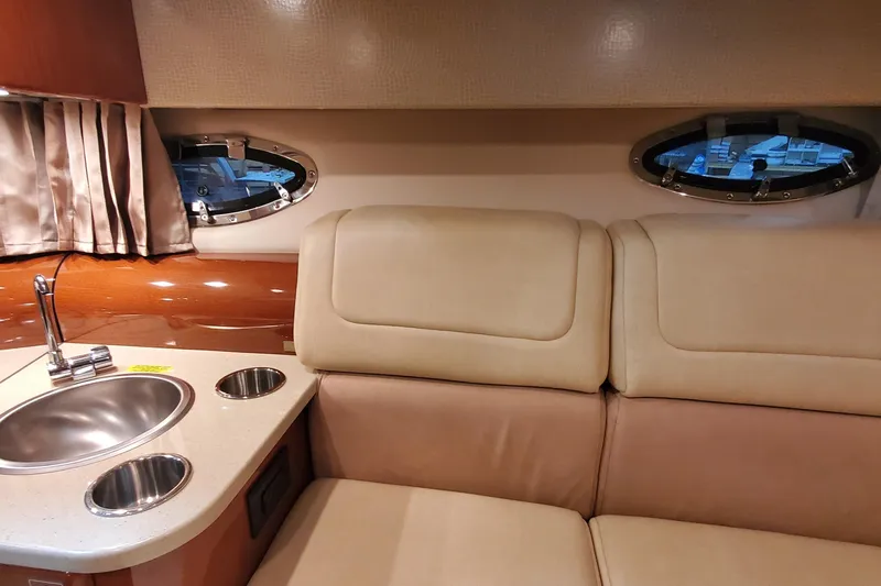 Slide: The Image of Interior of 2012 Formula 310 Sun Sport boat with beige seating and compact kitchenette. - 38