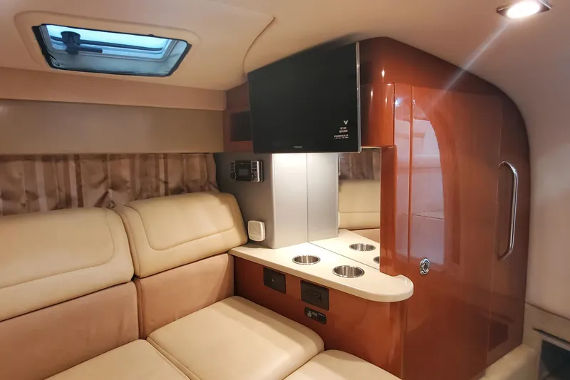 Slide: The Image of Luxurious interior of 2012 Formula 310 Sun Sport boat with beige seating and modern amenities. - 40