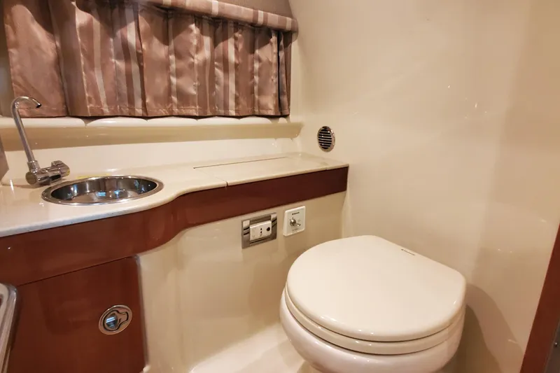 Slide: The Image of 2012 Formula 310 Sun Sport bathroom with sink, toilet, and curtain. - 42