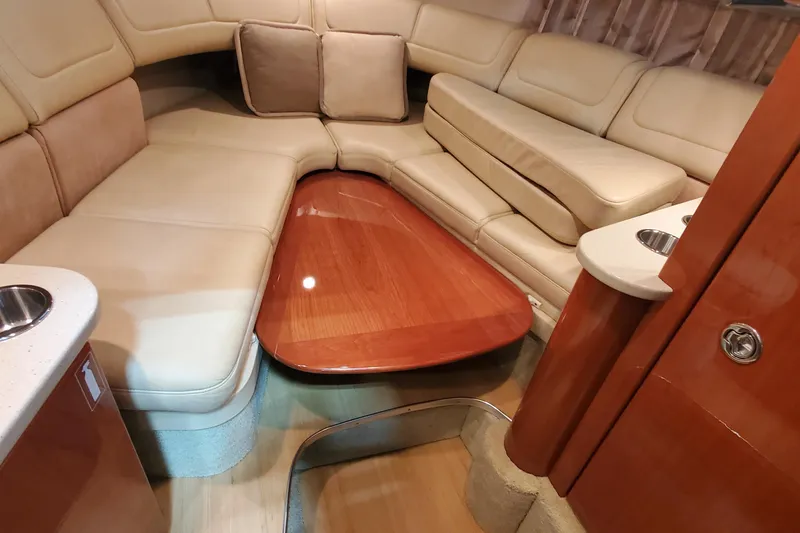 Slide: The Image of Luxurious interior of a 2012 Formula 310 Sun Sport boat with plush seating and wooden table. - 46