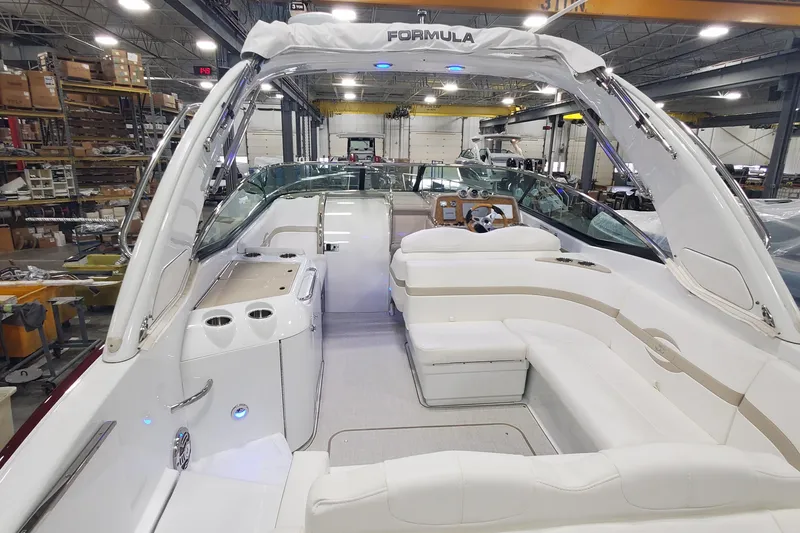 Slide: The Image of 2012 Formula 310 Sun Sport boat interior with white seating and modern dashboard. - 47