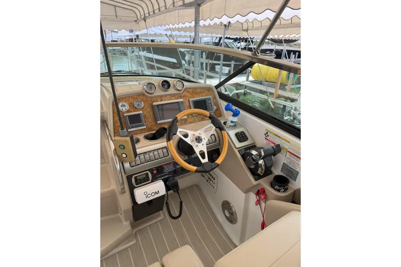 Slide: The Image of Cockpit of 2012 Formula 310 Sun Sport boat with steering wheel and control panel. - 48