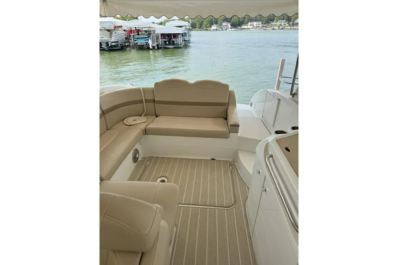 Slide: The Image of Interior of 2012 Formula 310 Sun Sport boat with beige seating and lake view. - 49