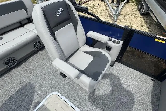 Slide: The Image of Captain's chair on 2026 Barletta ARIA 22UC pontoon boat, featuring cup holders and armrests. - 13