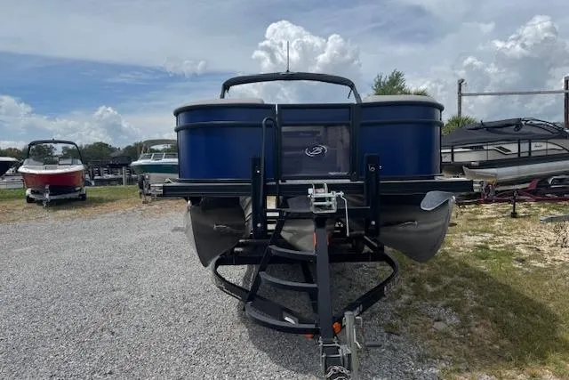Slide: The Image of 2026 Barletta ARIA 22UC pontoon boat on trailer, parked outdoors. - 4
