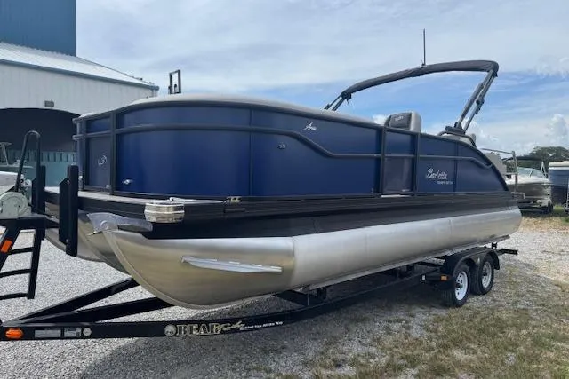 Slide: The Image of 2026 Barletta ARIA 22UC pontoon boat on trailer, parked outdoors. - 5