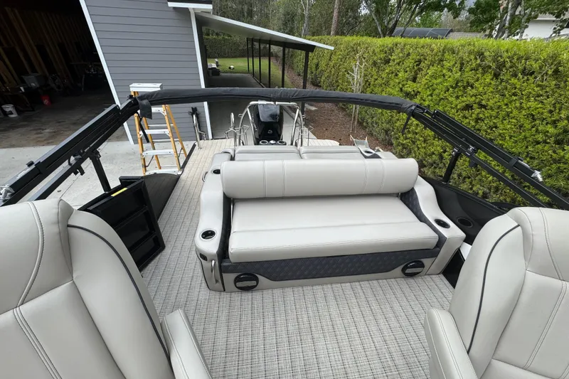 Slide: The Image of 2019 Barletta L25UCL pontoon boat interior with beige seating and modern design. - 10