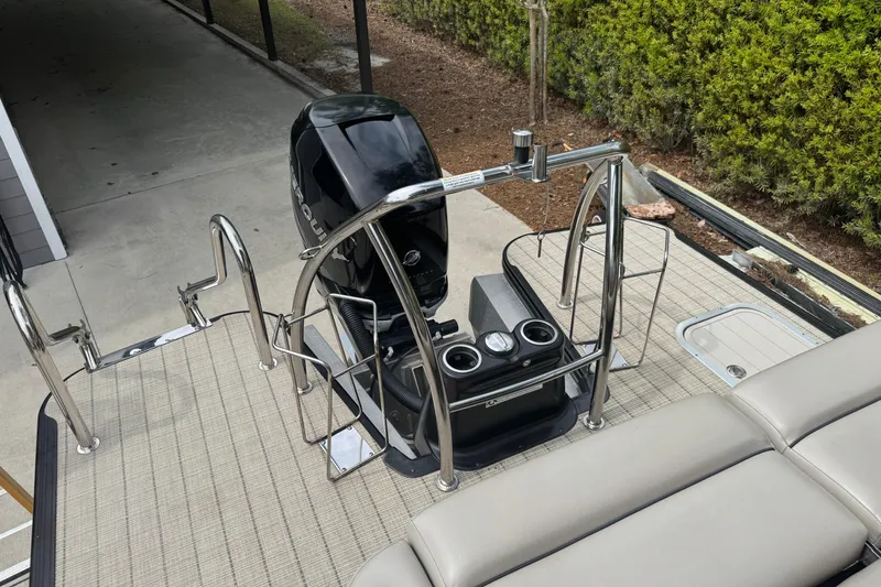 Slide: The Image of 2019 Barletta L25UCL pontoon boat with Mercury outboard motor and stainless steel railings. - 12