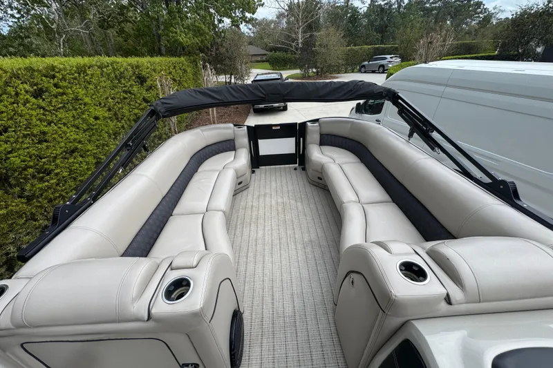 Slide: The Image of 2019 Barletta L25UCL pontoon boat with spacious seating and cup holders. - 13