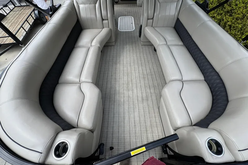 Slide: The Image of Luxurious seating on a 2019 Barletta L25UCL pontoon boat, featuring plush upholstery. - 15
