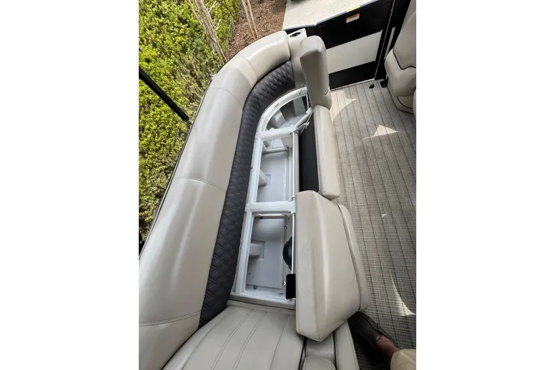 Slide: The Image of 2019 Barletta L25UCL pontoon boat interior with open storage compartment. - 17