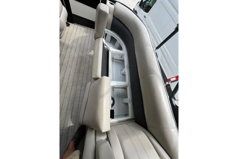 Slide: The Image of 2019 Barletta L25UCL boat interior with beige seating and storage compartments. - 18