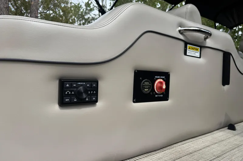 Slide: The Image of 2019 Barletta L25UCL boat interior with control panel and battery switch. - 19
