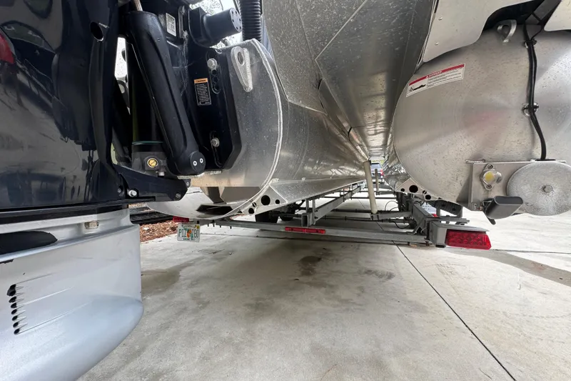 Slide: The Image of Underneath view of a 2019 Barletta L25UCL pontoon boat on a trailer. - 5