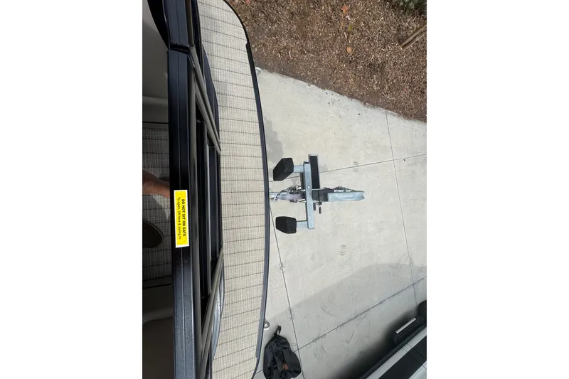 Slide: The Image of 2019 Barletta L25UCL boat trailer hitch on concrete driveway. - 6