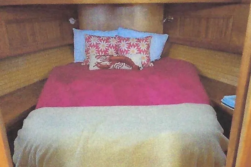 Slide: The Image of Cozy cabin bedroom in 2004 Sabre 42 Fly Bridge yacht with colorful bedding. - 13