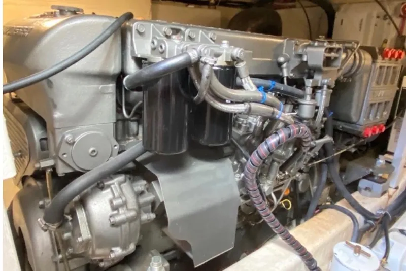 Slide: The Image of Engine of a 2004 Sabre 42 Fly Bridge boat, showcasing intricate mechanical components. - 14