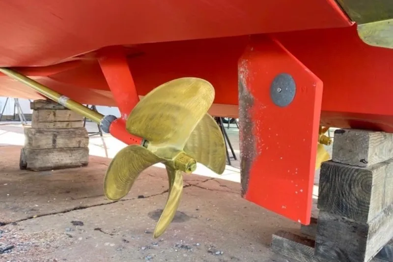 Slide: The Image of Propeller and rudder of 2004 Sabre 42 Fly Bridge on dry dock. - 16