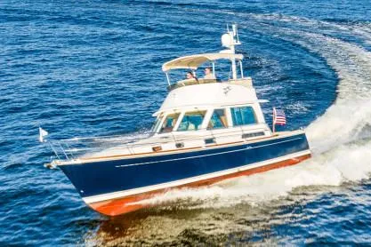 Slide: The Image of Manufacturer Provided Image: 2019 Sabre 42 Fly Bridge yacht cruising on open water. - 18